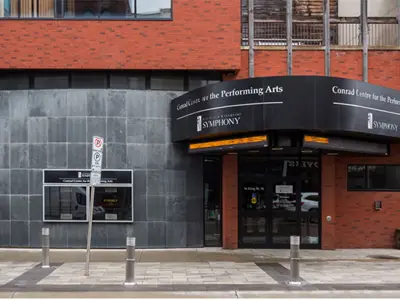Front of building with Conrad Centre for the Performing Arts written on it
