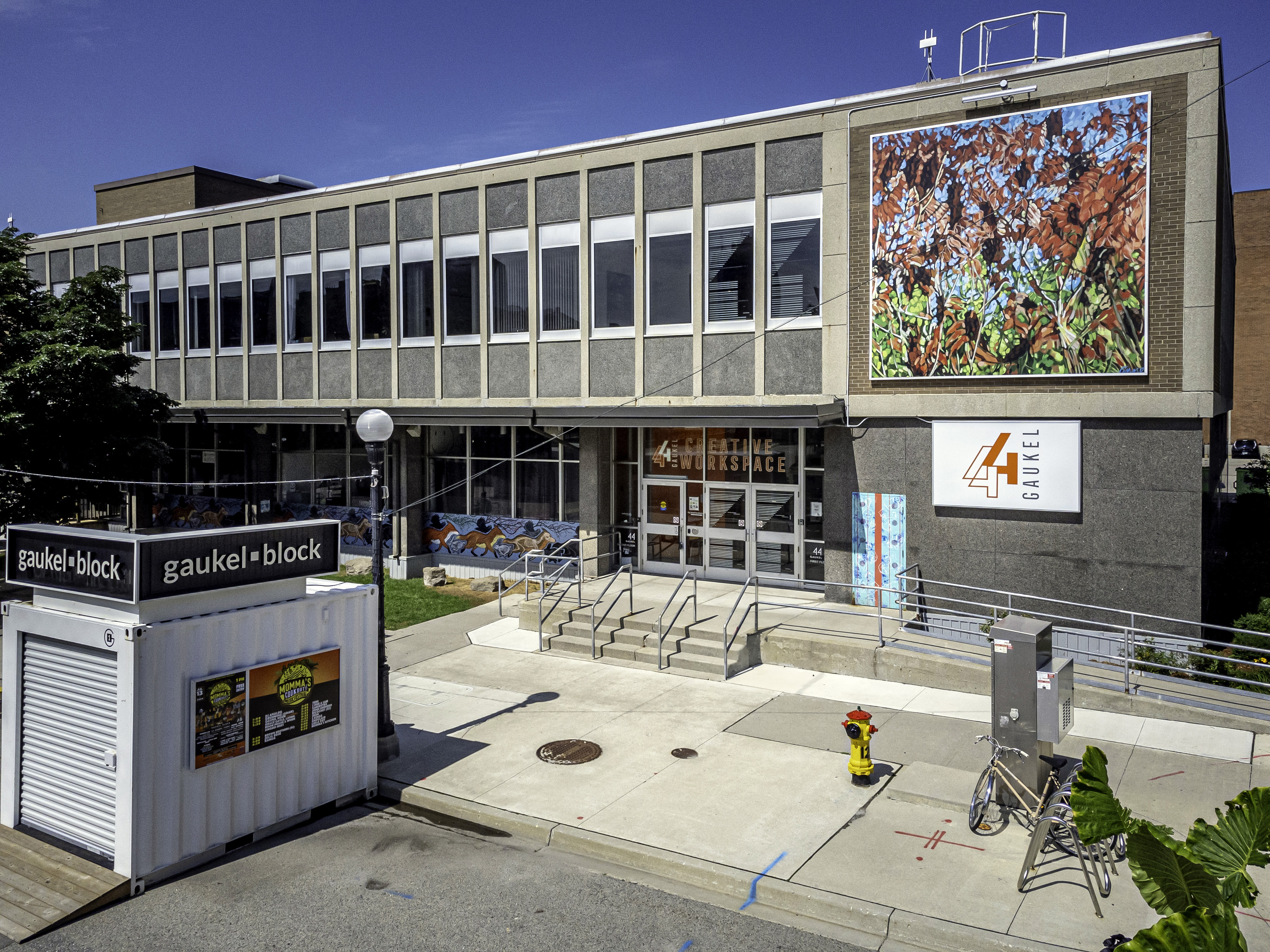 front of building with colourful art on it