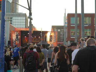 crowd at outside concert looking at stage