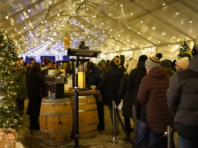 Patrons walking inside the main tent at Christkindl Market